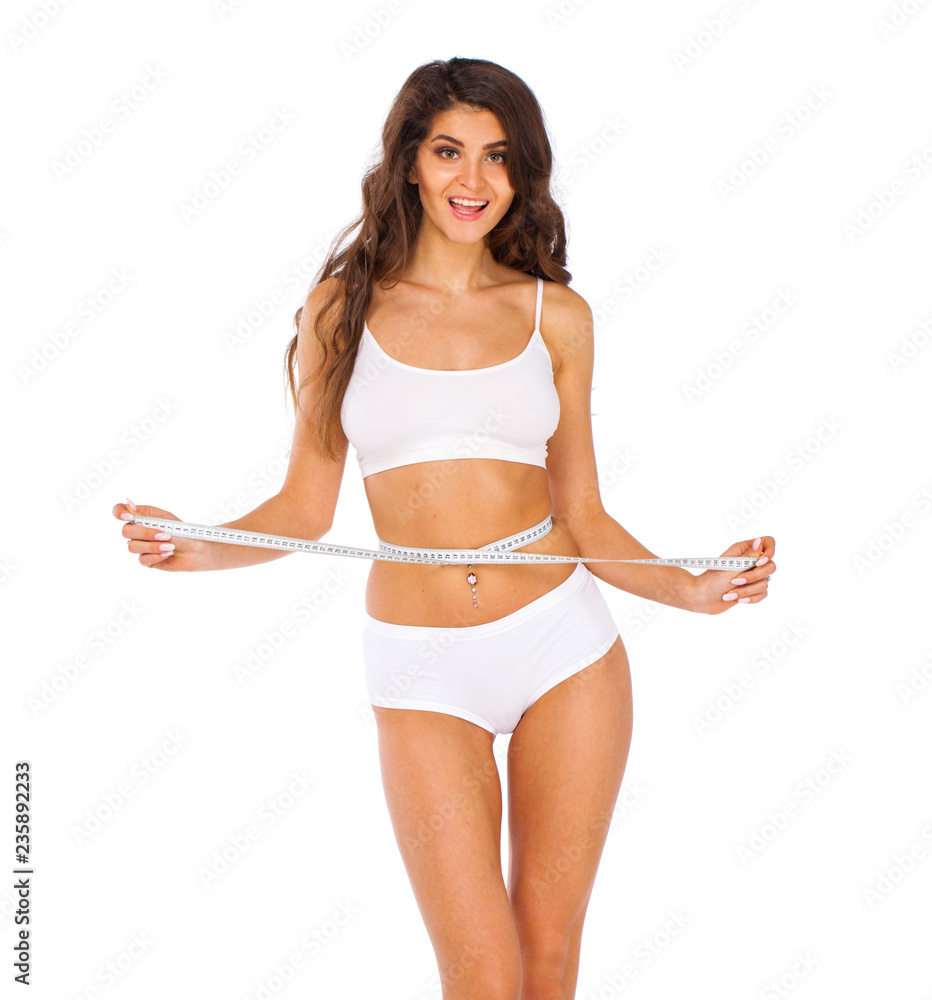 Young beautiful woman in white fitness clothing Young beautiful woman in white fitness clothing