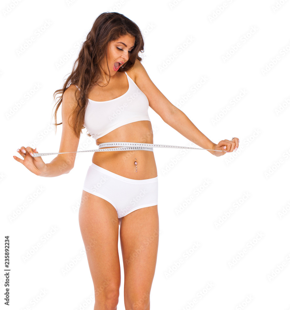 Young beautiful woman in white fitness clothing Young beautiful woman in white fitness clothing