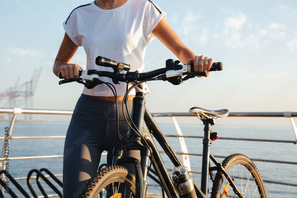 Fototapeta premium Cropped image of a young fitness girl