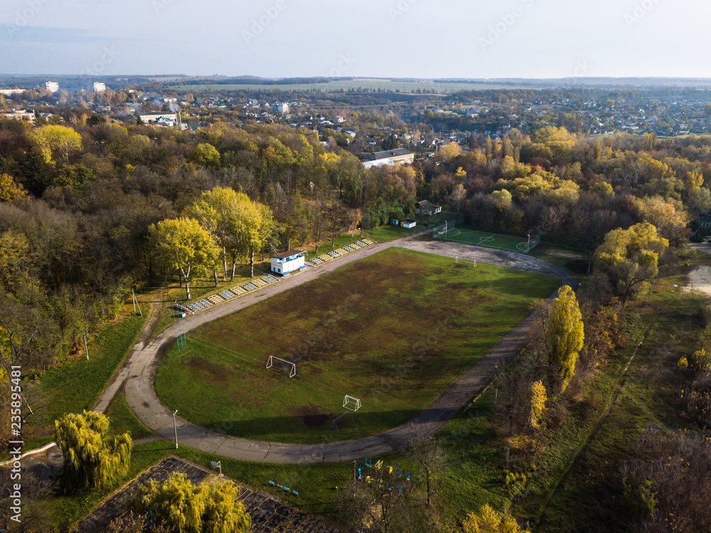 Obraz premium Aerial: Stadium in Kamianka town, Ukraine, in autumn