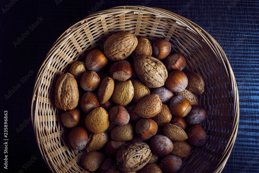 nuts, hazelnuts and almonds in a basket nuts, hazelnuts and almonds in a basket