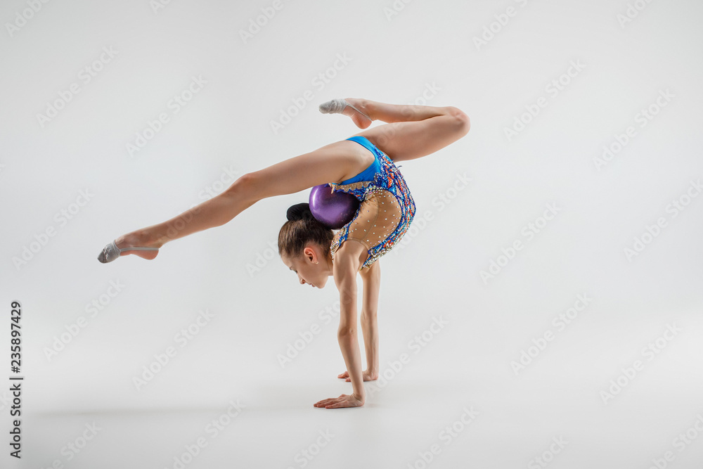 The teenager girl doing gymnastics exercises - Stock Photo