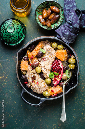 Chicken and pumpkin tagine with olives and pomegranade