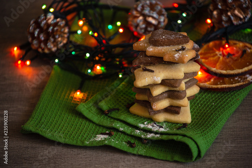 Stack of Homemade Christmas Cookies on Green Hapkin , with Copy Space. Light on a Background