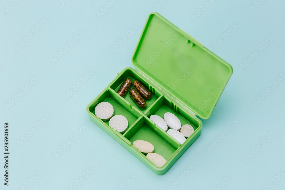 various tablets and capsules for treatment of the disease in special box various tablets and capsules for treatment of the disease in special box