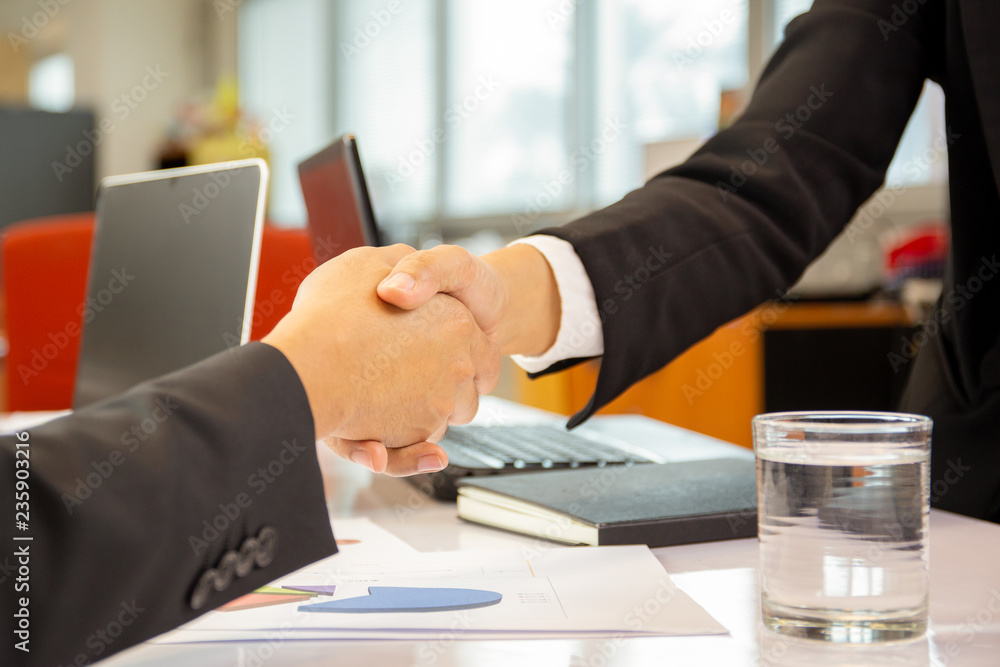 Successful businessmen handshak agreement after good deal in office. - obrazy, fototapety, plakaty 