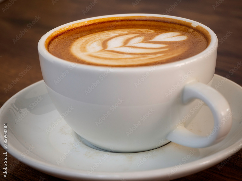 Fototapeta premium White coffee cup on wood table, coffee time
