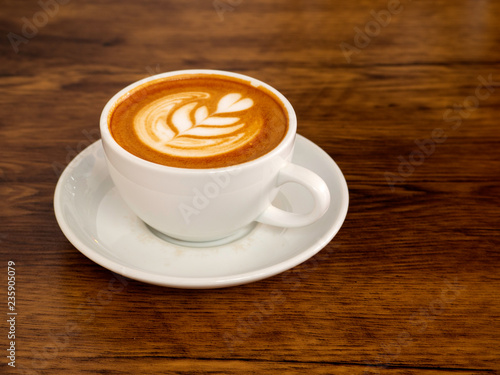 White coffee cup on wood table, coffee time