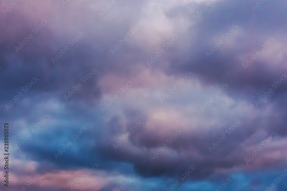 Colored cloudy sky background. The skies are lit up in the sun.