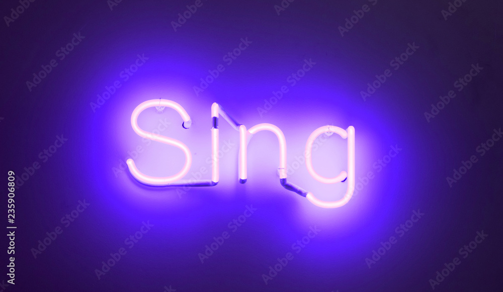 Neon sign - Shining over a white wall Neon sign - Shining over a white wall