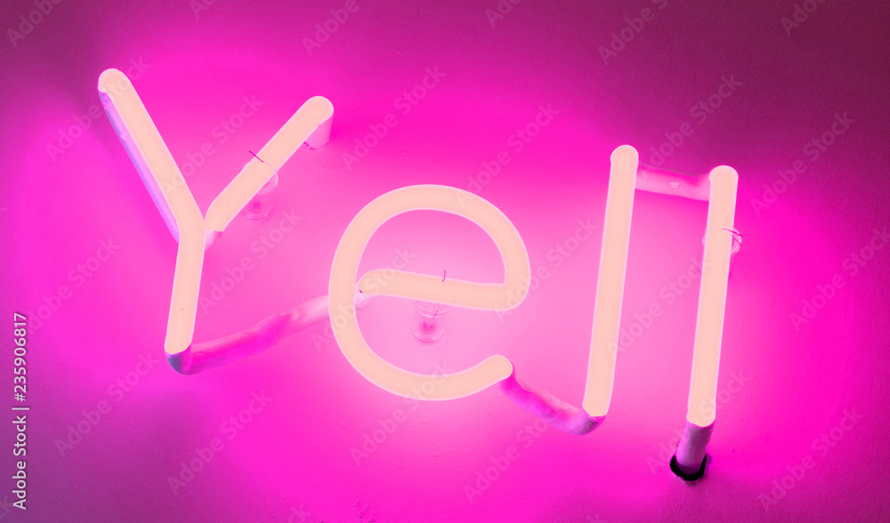 Neon sign - Shining over a white wall Neon sign - Shining over a white wall