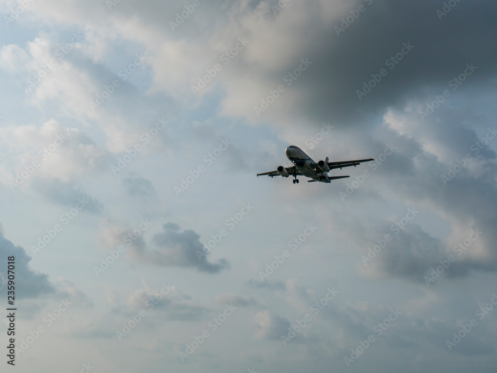 Flying Airplane in the sky with Sun and clouds Flying Airplane in the sky with Sun and clouds