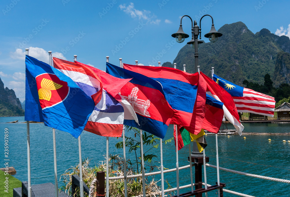 View of national flags of Southeast Asia countries. Brunei Darussalam, Myanmar Burma, Cambodia, Indonesia, Laos, Malaysia, Philippines, Singapore, Thailand, Vietnam, East Timor. Nature background