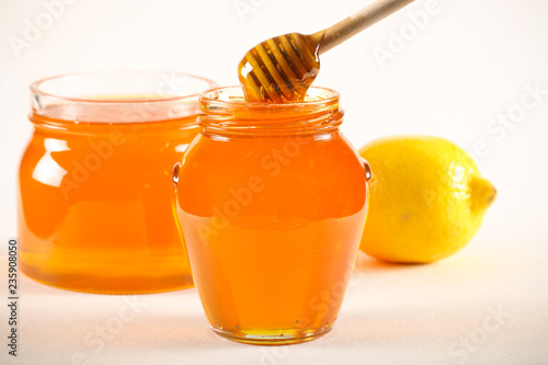 мёд в бочке свежий урожай и орехи разные стоят на столе 
