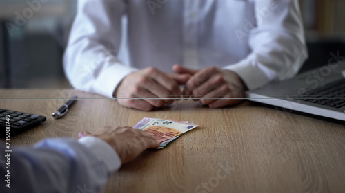 Cuadro en lienzo Bank client giving euros to bank clerk, money exchange service, foreign currency
