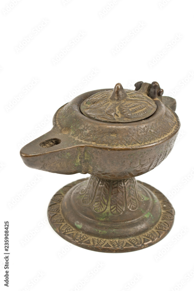 Antique bronze oil lamp isolated on white Antique bronze oil lamp isolated on white