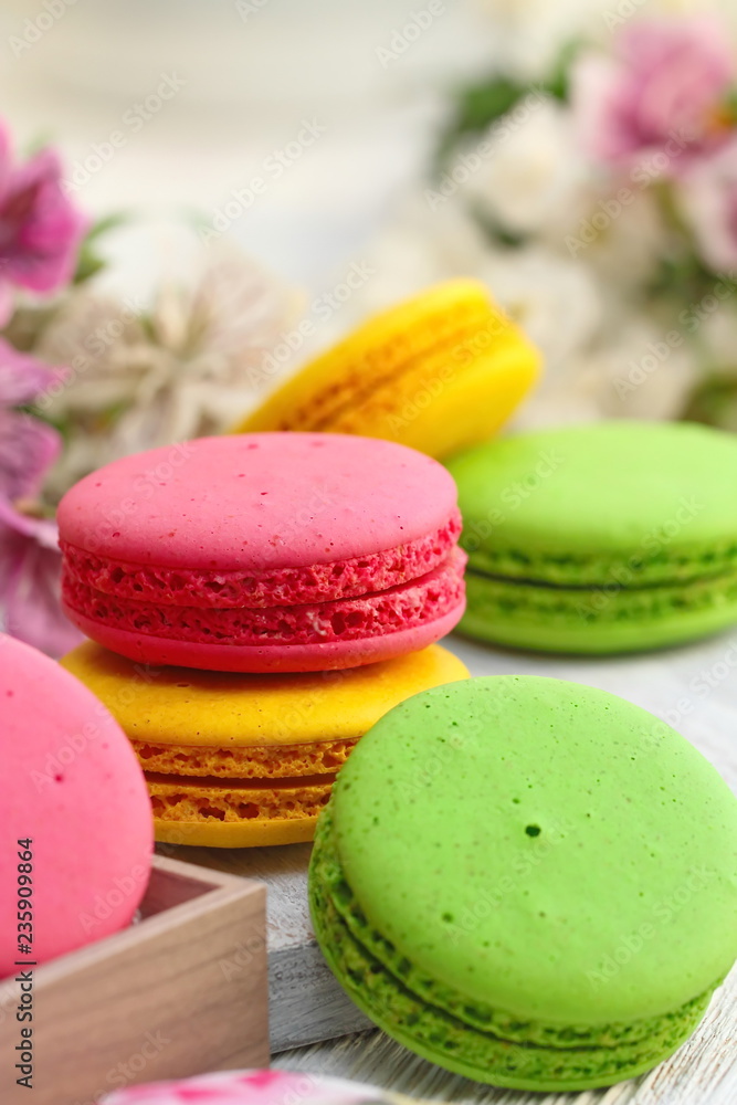 Colorful macaroons on wooden table. Sweet dessert Colorful macaroons on wooden table. Sweet dessert