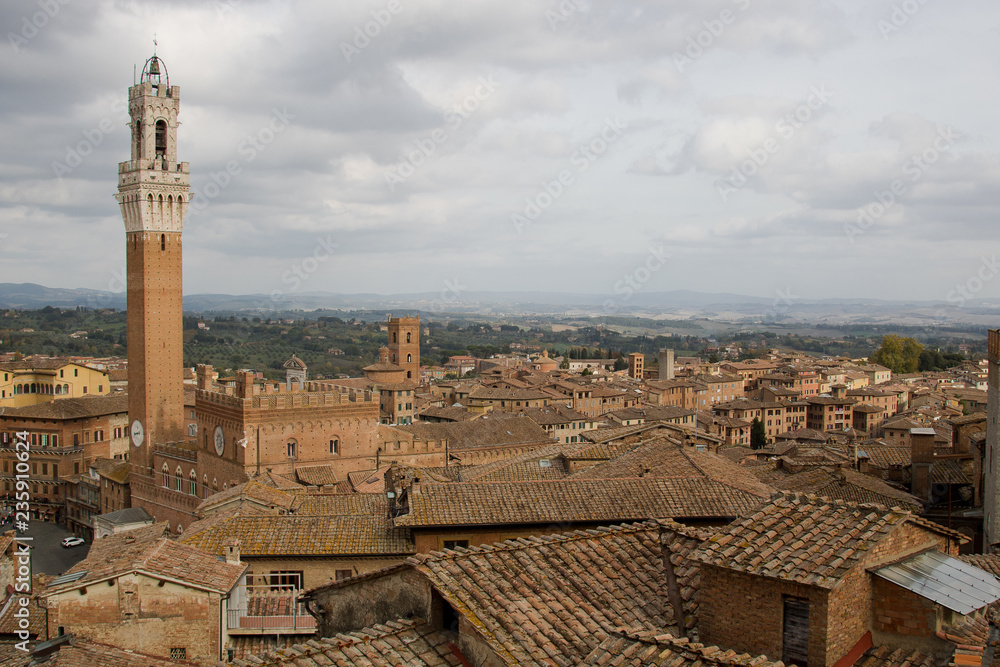 Siena, panoramic view. Panoramic view of Siena with main tower of the city in foreground 