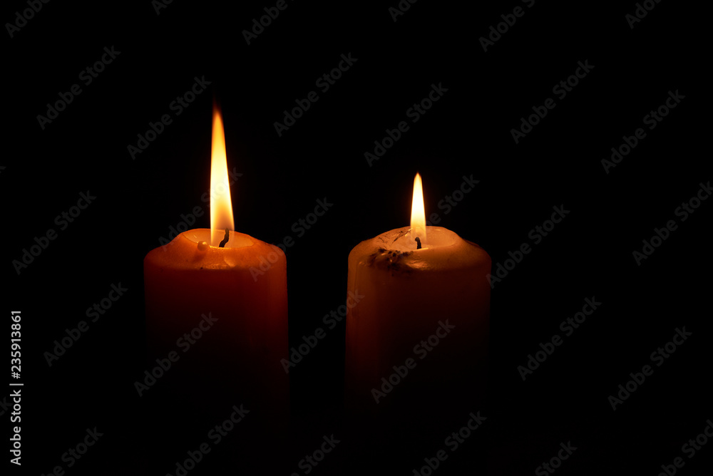 Two candlelights in the dark backgroud