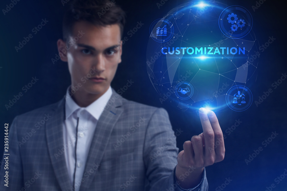 The concept of business, technology, the Internet and the network. A young entrepreneur working on a virtual screen of the future and sees the inscription: Customization The concept of business, technology, the Internet and the network. A young entrepreneur working on a virtual screen of the future and sees the inscription: Customization