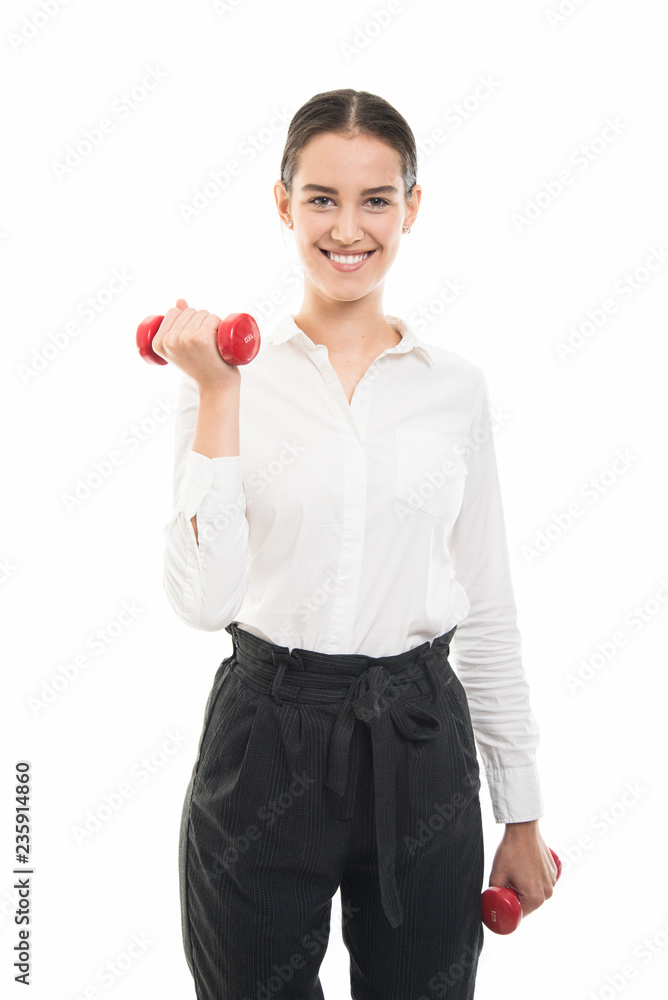 Young pretty business woman working out with dumbbells Young pretty business woman working out with dumbbells