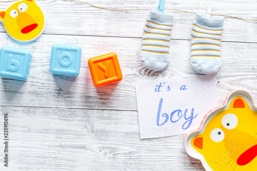 birth of boy - baby shower concept on wooden background