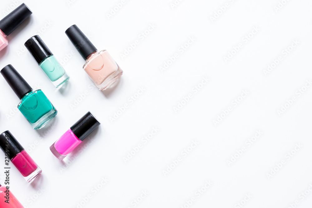 Obraz premium hands care concept with nail polish white desk background top vi