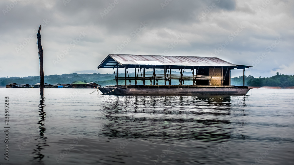 The floating house rafting at the river Kwai, landscape, Vajiralongkorn Dam, Kanchanaburi, Thailand, Travel concept.