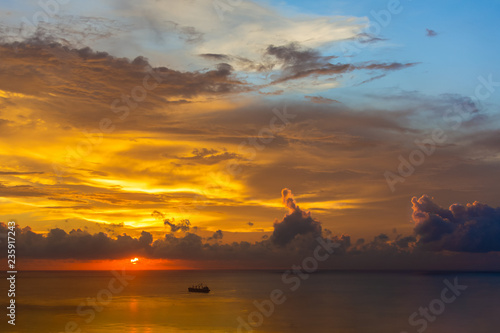 Magnificent colored clouds on the sea at sunset in the evening