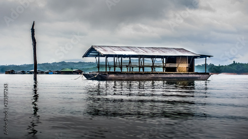 The floating house rafting at the river Kwai, landscape, Vajiralongkorn Dam, Kanchanaburi, Thailand, Travel concept. © WUTTHICHAI90