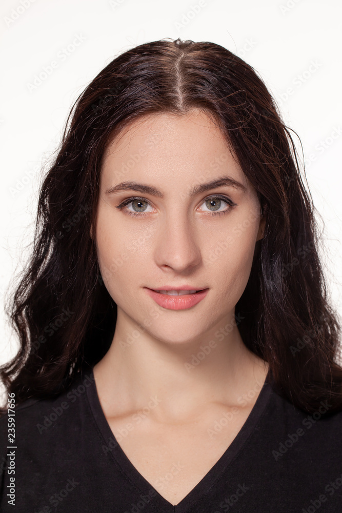 Attractive woman with black t-shirt isolated on a over white background Attractive woman with black t-shirt isolated on a over white background