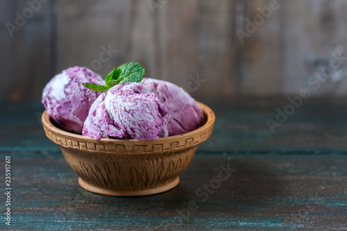 Homemade ice cream blueberries and mint. © Gulsina
