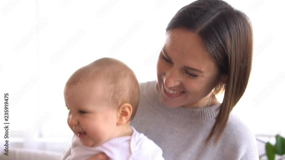 Happy mother playing with baby daughter Happy mother playing with baby daughter
