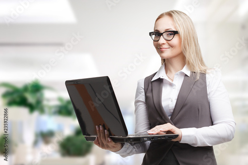 The concept of business, technology, the Internet and the network. Business woman is working on computer