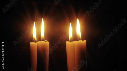 Christmas feeling with candles.  Close up on burning candles moving slowly in a circle.