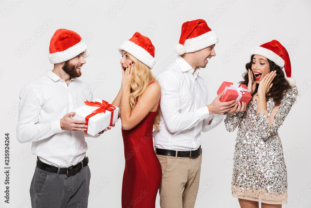 Fototapeta premium Group of happy friends dressed in red hats