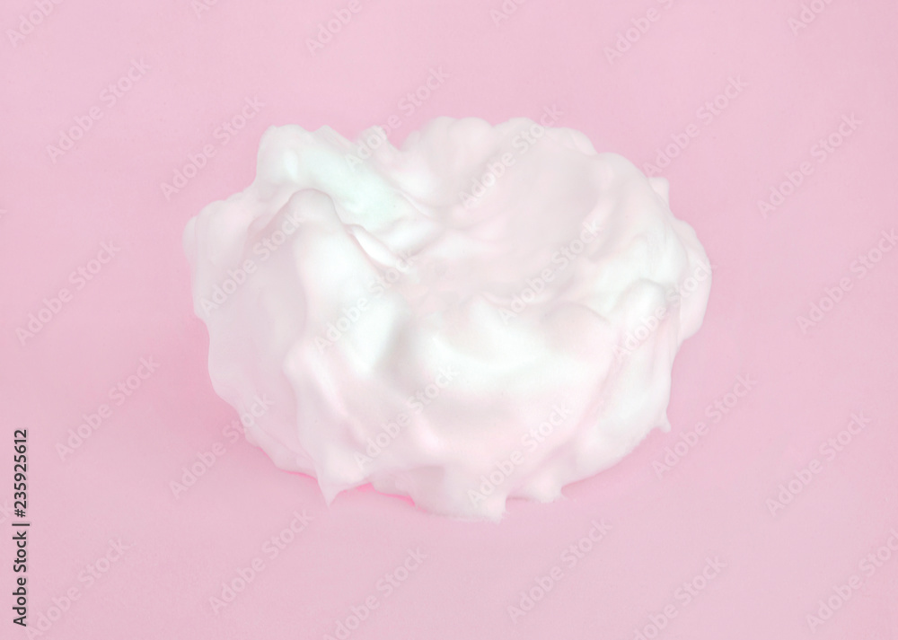Gentle cosmetic white cream on pastel pink background.