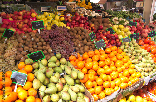 Stands full of fresh fruits at a local greengrocers