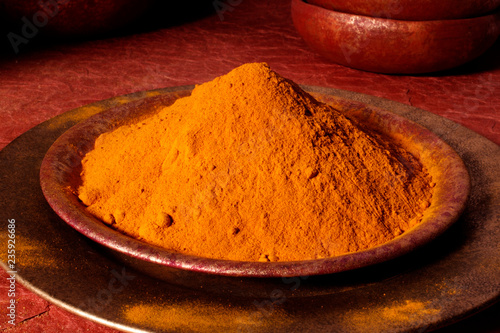 BOWL OF TUMERIC POWDER photo