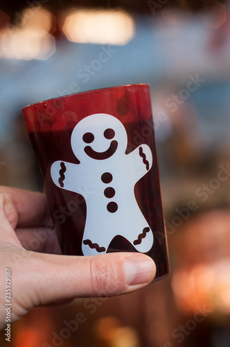 Strasbourg - France - 24 November 2018 -  mulled wine in traditional cup in hand at the christmas market photo