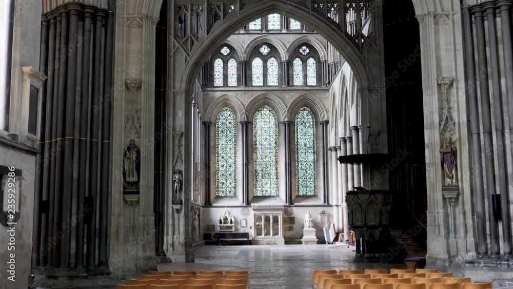 Zoom in-Interior Salisbury Cathedral to pulpit and stained glass windows Zoom in-Interior Salisbury Cathedral to pulpit and stained glass windows