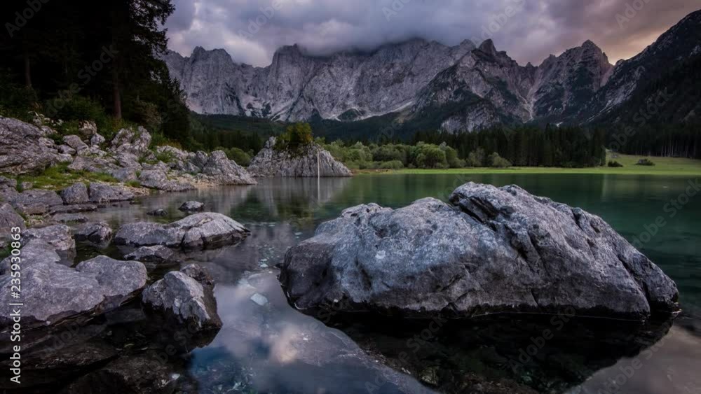 Time Lapse - Sunset at the Lago di Fusine with colourful clouds Time Lapse - Sunset at the Lago di Fusine with colourful clouds