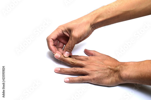 Photography the finger of right hand provoking the nail of left hand on white background iso