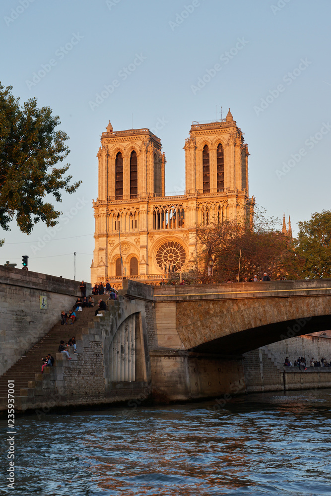 View of Notre Dame de Paris from the river at sunset