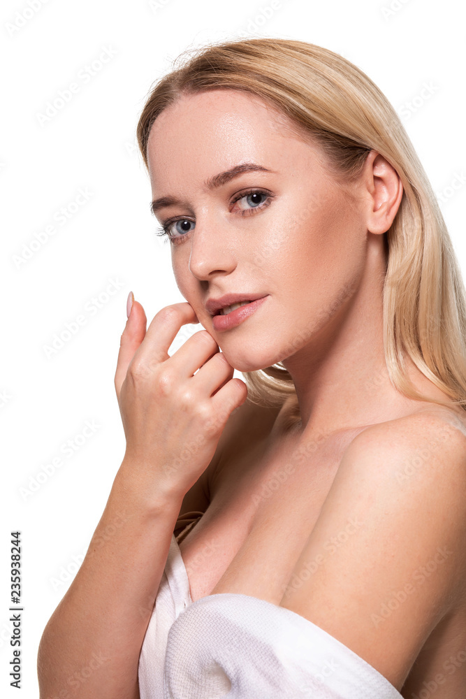 Beautiful face of young blond woman with clean fresh skin and natural make up on white background. Beautiful face of young blond woman with clean fresh skin and natural make up on white background.