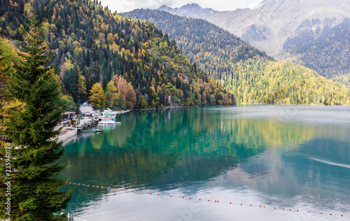 Fototapeta Naklejka Na Ścianę i Meble -  Beautiful lake surrounded by mountains and forests in autumn, Ritsa, Abkhazia.