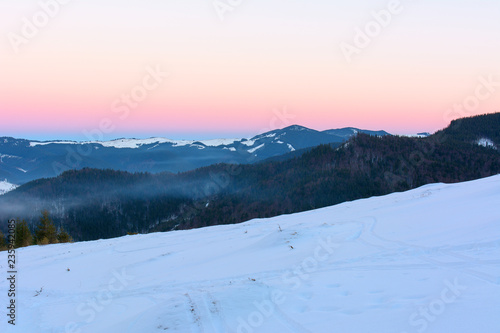 Sunset in the mountains in winter © Yurii Shelest