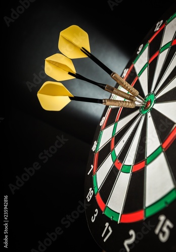 Fotografie Closeup of Darts in Bullseye