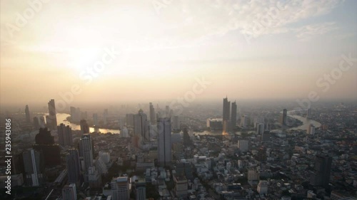 Sunset, Dusk to night, Aerial view of Chao Phraya river, Bangkok's city, Thailand, Time lapse.