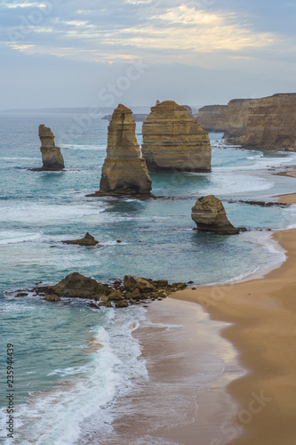 Travel Victoria, Australia, Great Ocean Road roadtrip Concept. Beautiful scenic landscape view of the tourist popular attraction twelve apostles, coastline of Tasman sea while sunset light.